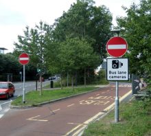 Bus lane enforcement camera signage at the junction of New Road and Brierly Furlong in Stoke Gifford, Bristol.