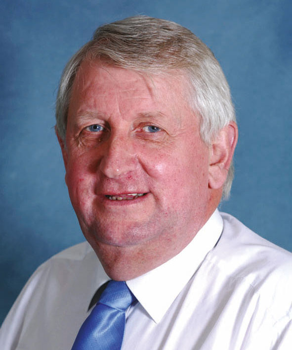 Head and shoulders photo of a man wearing a shirt and tie. 