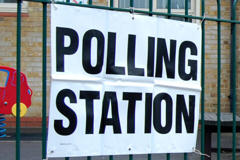 Photo of a 'polling station' sign.