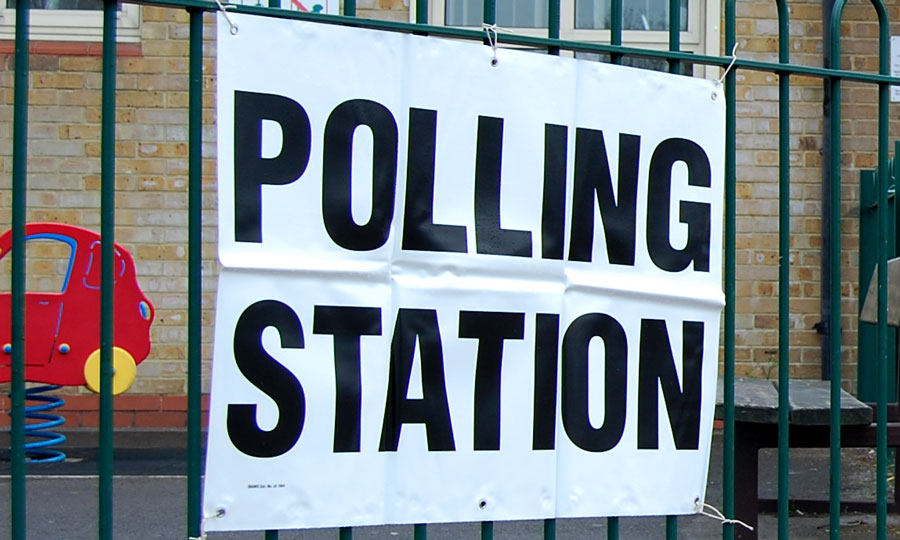 Photo of a 'polling station' sign.